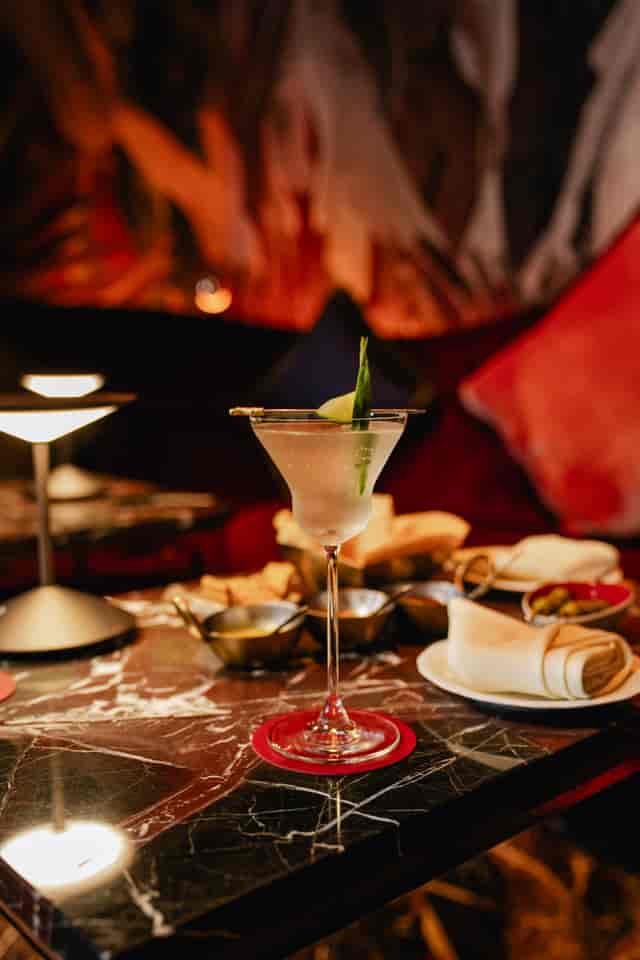 Shikhar Bar cocktail service: moody VIP reception and high-end networking event setting.