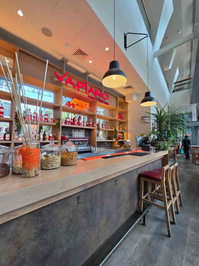 Vibrant Vapiano bar area, ideal for casual networking events and celebrations.