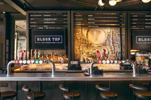 Black Tap venue buyout: spacious bar for casual corporate happy hour and team building events.