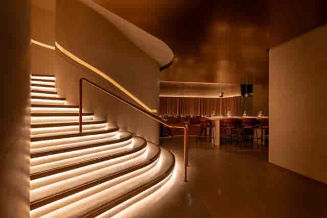 Luxury venue for VIP reception and brand activation with dramatic architectural lighting.