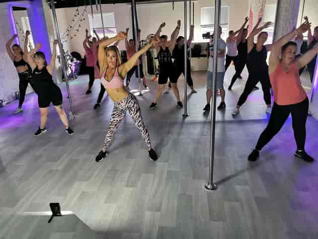 Sxefit Studio group fitness session: high-energy workout class for corporate team building events.