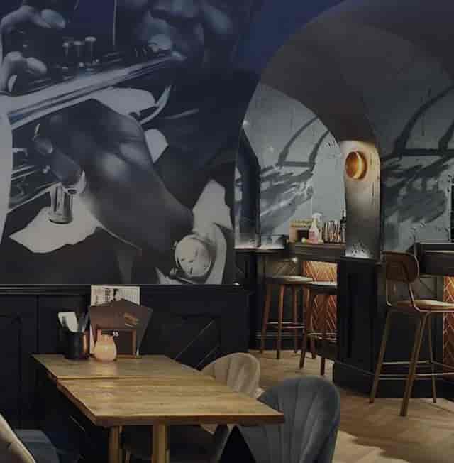 The Gear Room at The Manor of Hurst featuring atmospheric bar seating for corporate events.