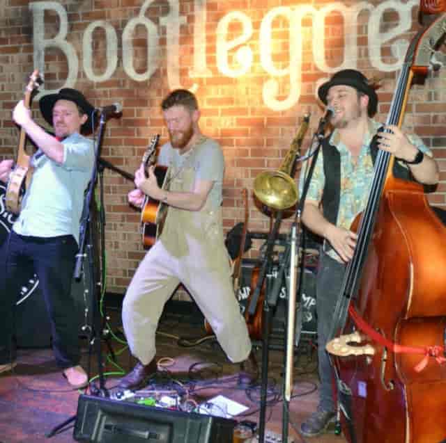 Acoustic trio performing at Bootlegger Bars Brighton, ideal for rustic weddings and networking.
