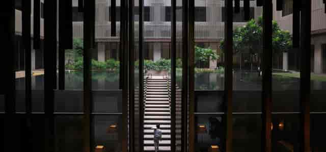 Elegant ballroom atrium with staircase, perfect for corporate gatherings and networking events.