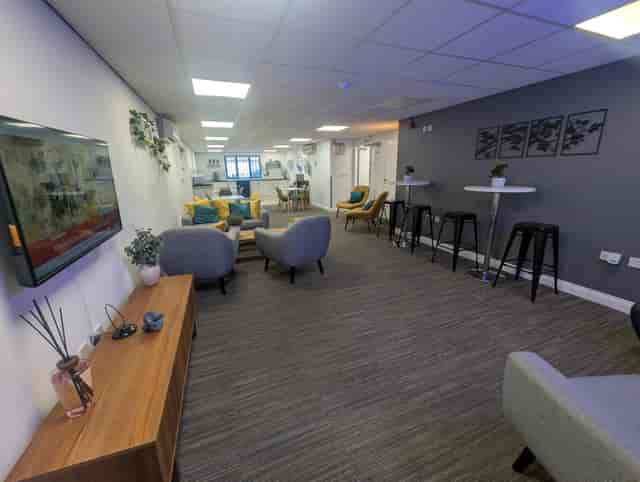 Modern meeting room at Bury Businesslodge for workshops and networking events.