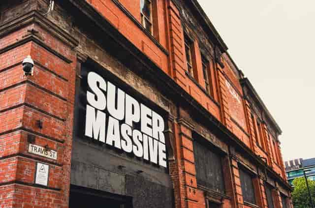 Rooftop bar SUPERMASSIVE with red brick exterior, ideal for creative events and gatherings.