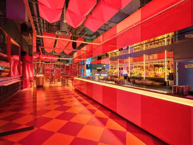 Vibrant 1/2 Fun House venue with dynamic colors for cocktail receptions or themed parties.