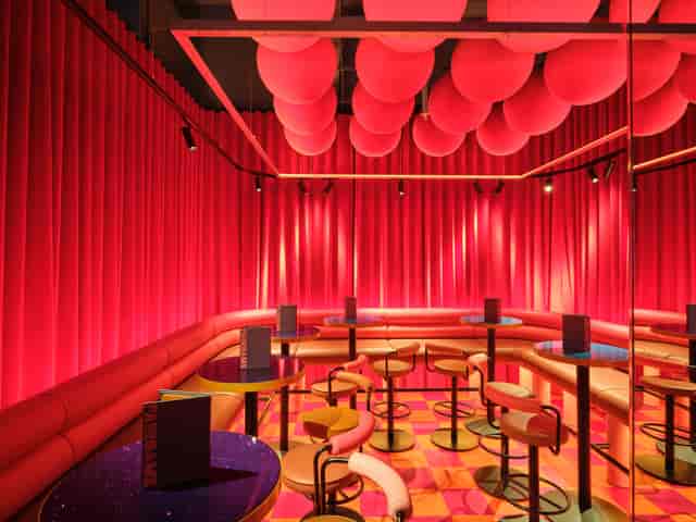 Vibrant 1/2 Fun House event space with bold decor for creative gatherings, ideal for themed parties.