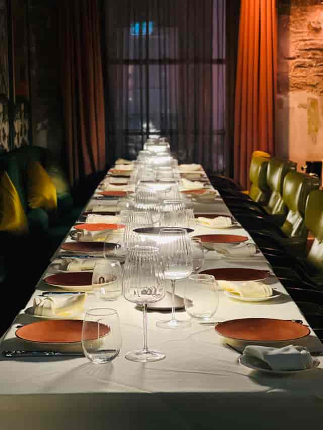 VATAVARAN long-table private dining room with atmospheric lighting for high-end VIP events.