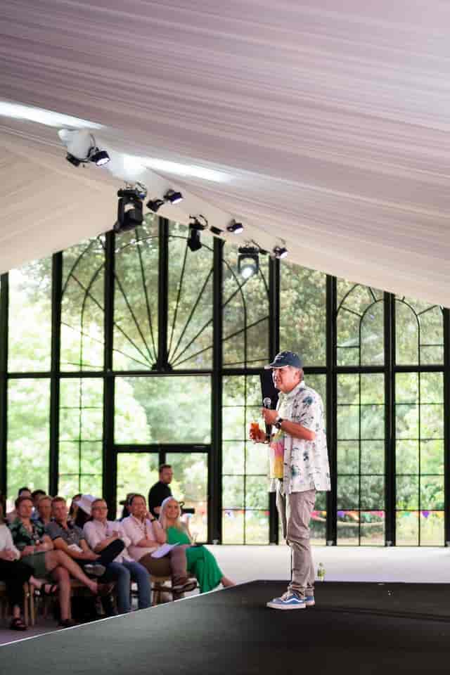 Speaker engaging attentive audience in bright, open venue at The Clementine, Syon Park event.