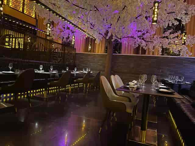 Karaoke function room with cherry blossom tree, perfect for upscale events in Shanghai.