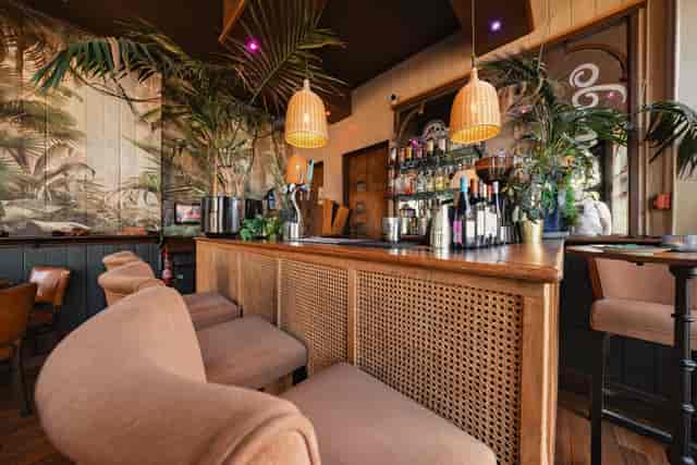 Private Dining area in Coriander Lounge, featuring tropical decor for cocktail receptions.