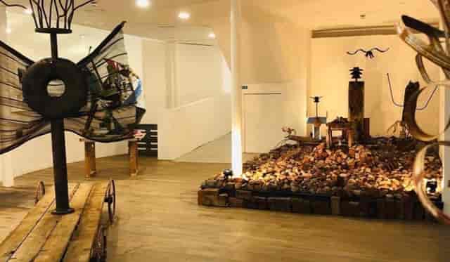 Seaside Gallery event space with industrial sculptures for boutique receptions and product launches.