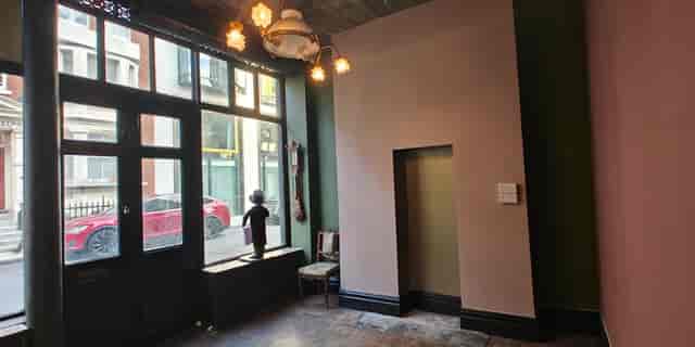 Vintage foyer at 41 Whitfield Street with large windows, ideal for event space or product launch.