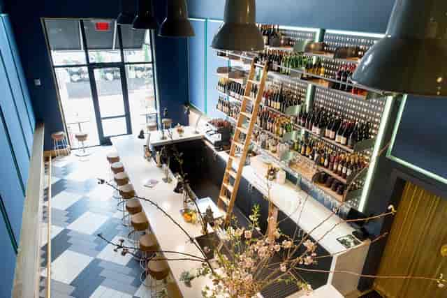 Modern bar area at Enoteca Alto, ideal for networking events and social gatherings.