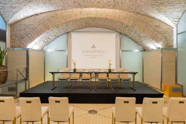 Panel discussion setup at The Diocleziano, Anantara Palazzo Naiadi, Rome. Elegant event space.