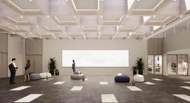 Modern event venue Scala with high ceilings for networking and meetings.