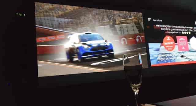 Private dining room with racing visuals for upscale corporate events and product launches.