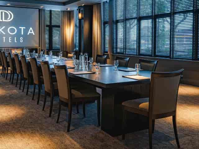 Modern meeting room at Dakota Hotels, perfect for corporate events and training sessions.