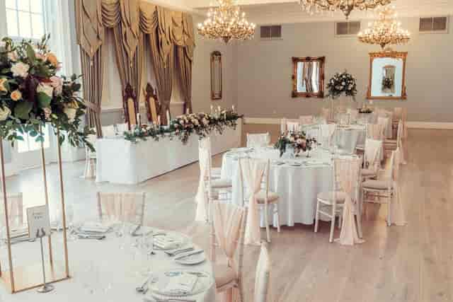 Kennedy Suite banquet setup with elegant floral decor for upscale weddings and formal events.