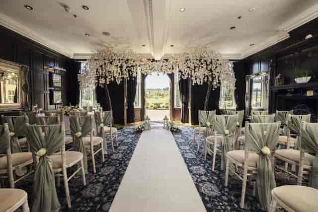 Main Function Suite at Slaley Hall: elegant wedding venue with floral arch and natural light.