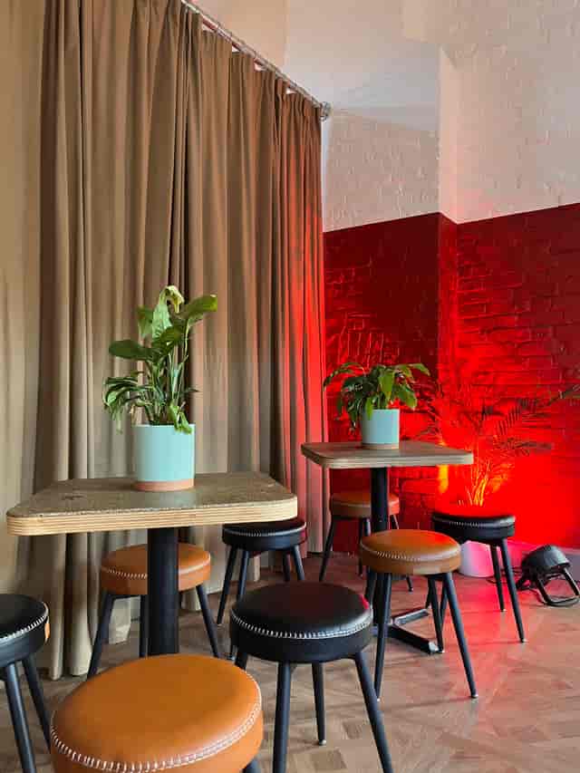 Moot Main Event Room with vibrant red lighting for professional networking and corporate events.