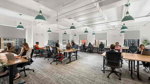 Modern District Lounge in NYC, featuring airy workspace for workshops and meetings.