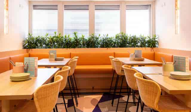 Modern dining area at Atico, Fonda Mexican, perfect for networking and casual gatherings.