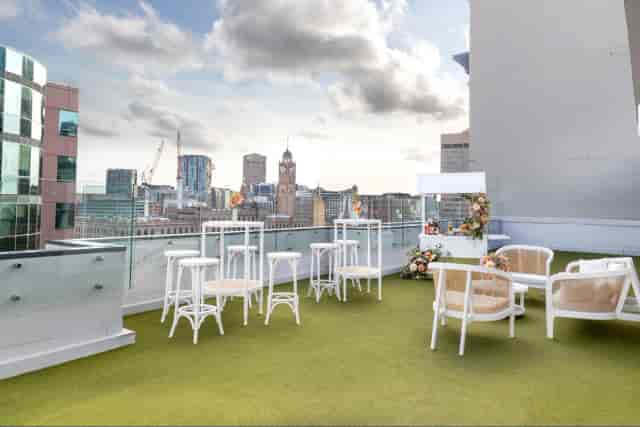 Surry Rooftop corporate reception with lounge seating and city skyline view.