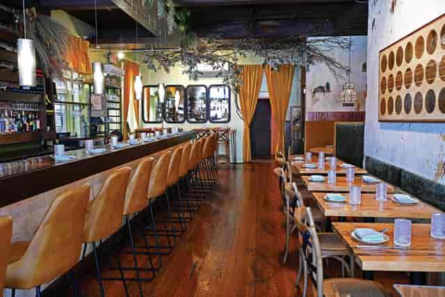 Modern Whisky Room with modular tables, perfect for networking mixers and corporate team building.