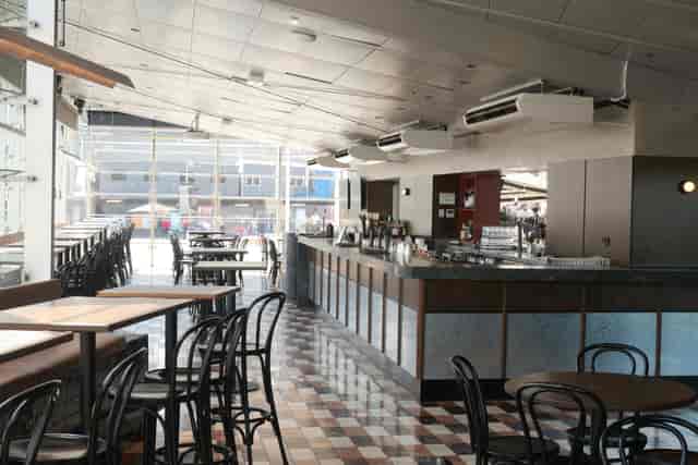 Modern indoor event space at Transit Rooftop Bar with ample seating and natural light.