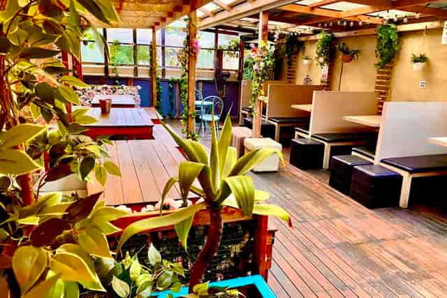 Vibrant Purple Emerald Lounge Bar venue with cozy seating for events and gatherings