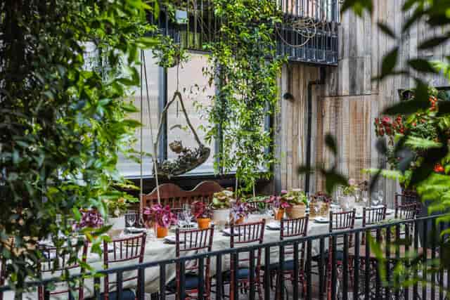 Jurema Terrace at The Mandrake: Rustic long-table setup for boutique dinners and private events.