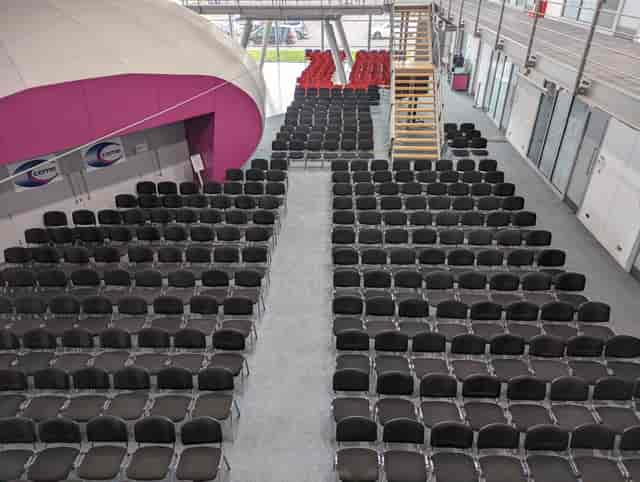 Atrium seating arrangement with black chairs for an engaging event at CEME Events Space.