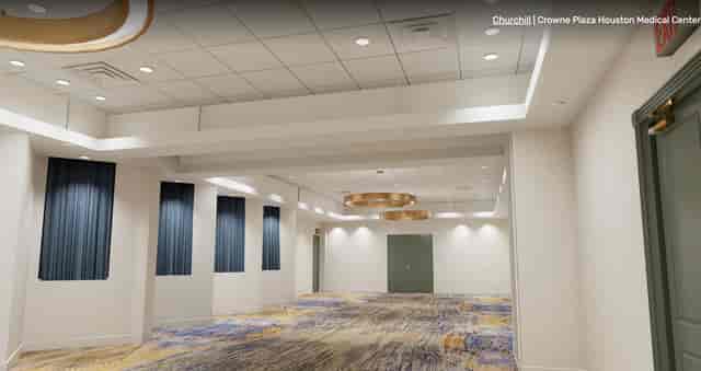 Windsor Ballroom in Crowne Plaza Houston: modern event space with natural light for meetings.