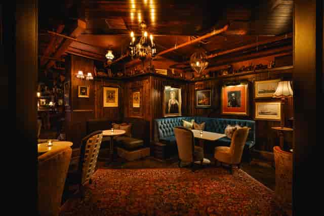 Elegant meeting space with wood paneling for intimate gatherings and events at Mr Fogg's.