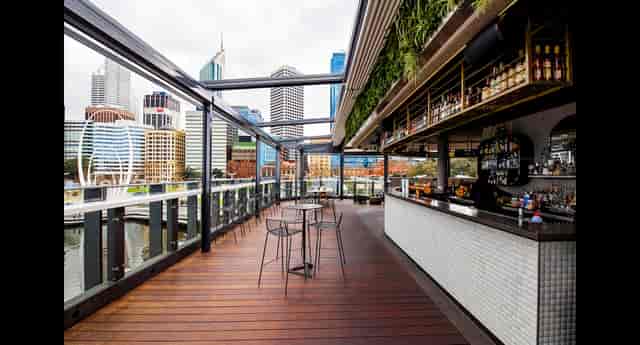 Henry's Rooftop Bar at The Reveley: retractable roof venue for cocktail receptions and networking.