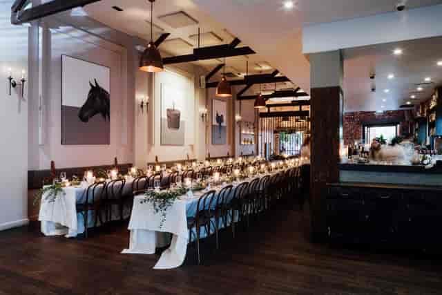 Intimate banquet setup at The Mezzanine, Wolf Lane with elegant long tables for rehearsal dinners.