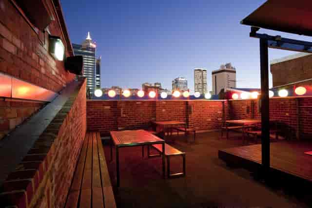 Rooftop terrace venue at Connections Nightclub with brick accents for evening mixers and events.