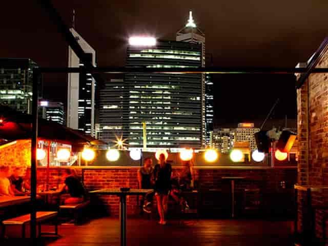 Rooftop venue at Connections Nightclub with city skyline, ideal for corporate networking events.