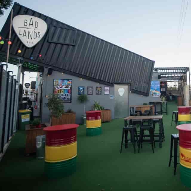 Industrial-chic Ivy Gardens outdoor venue with drum seating for networking and social events.