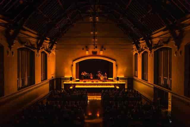 Main Hall at Perth Town Hall with warm stage lighting for corporate keynote and panel events.