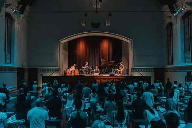 Perth Town Hall Supper Room stage with warm spotlights for acoustic wellness events.