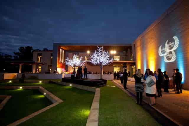 Sophisticated evening reception at University Club WA with branded lighting for corporate events.