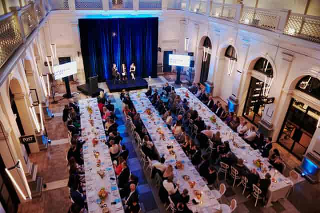Corporate gala banquet at Postal Hall: historic atrium venue for formal business events.