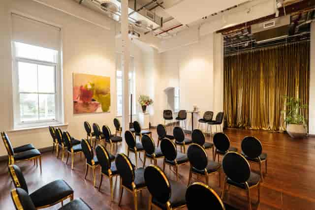 The Mark venue with gold-framed chairs for elegant panel discussions and boutique product launches.