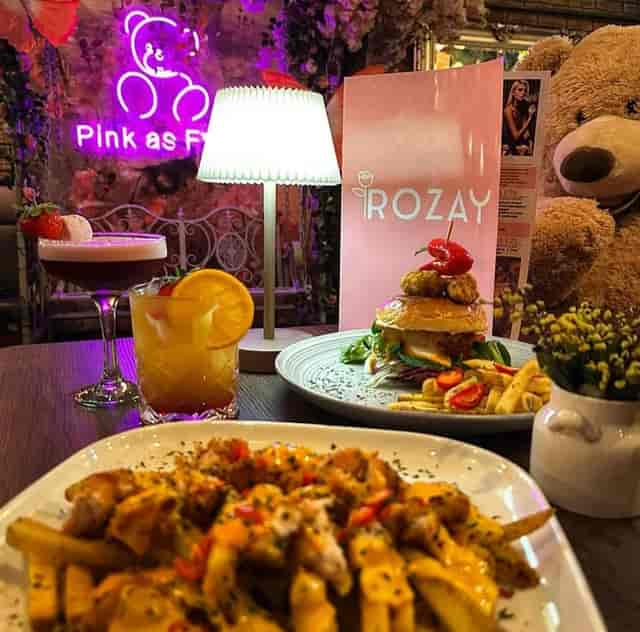 Private room at Rozay Lounge with vibrant dining, ideal for social events and celebrations.