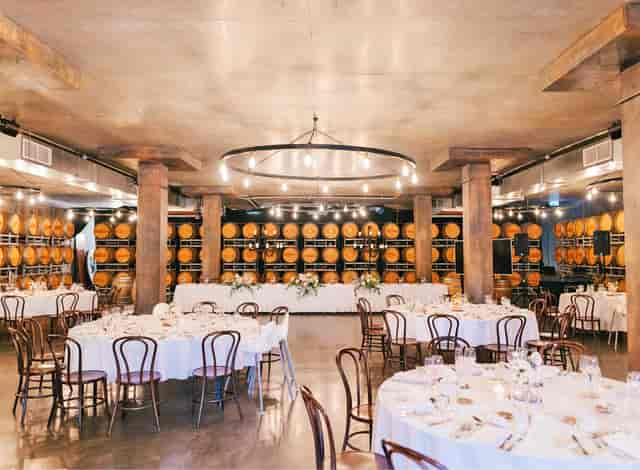 Sandalera Room at Sandalford Wines: industrial wine-country event space with barrel wall decor.