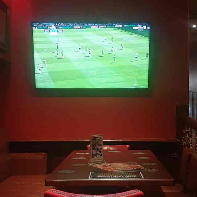 Cozy reserved booths at The George Payne for casual watch parties and networking events.