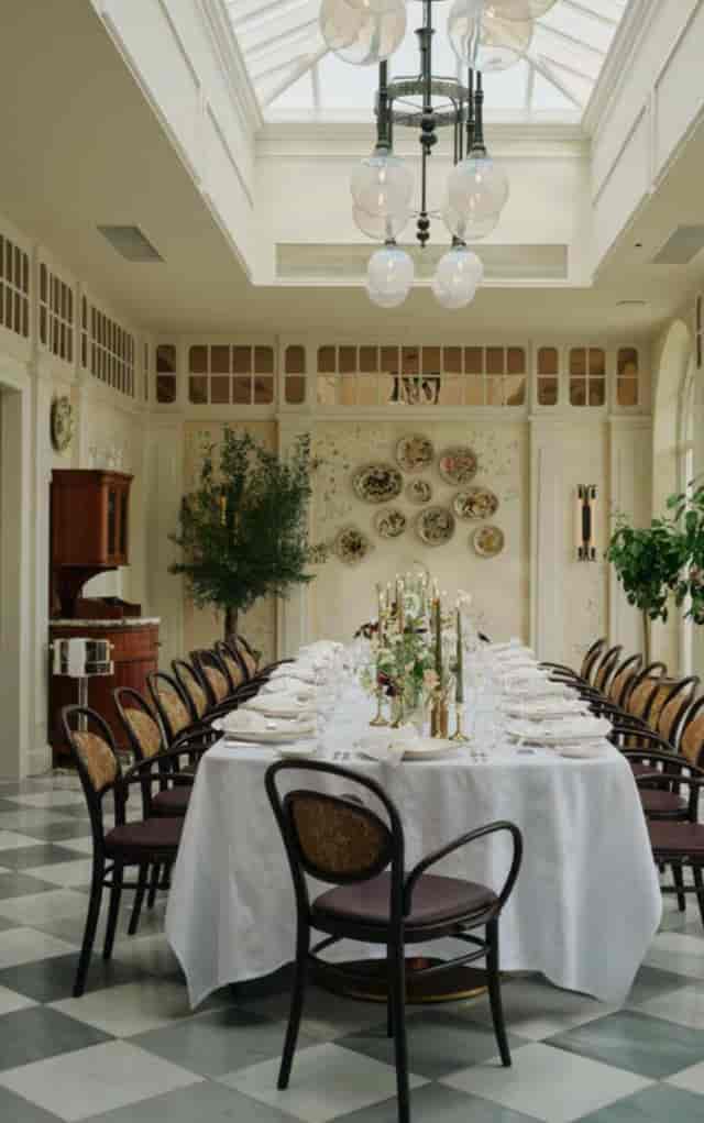 Elegant long table setup in The Orangery, ideal for upscale events and gatherings.